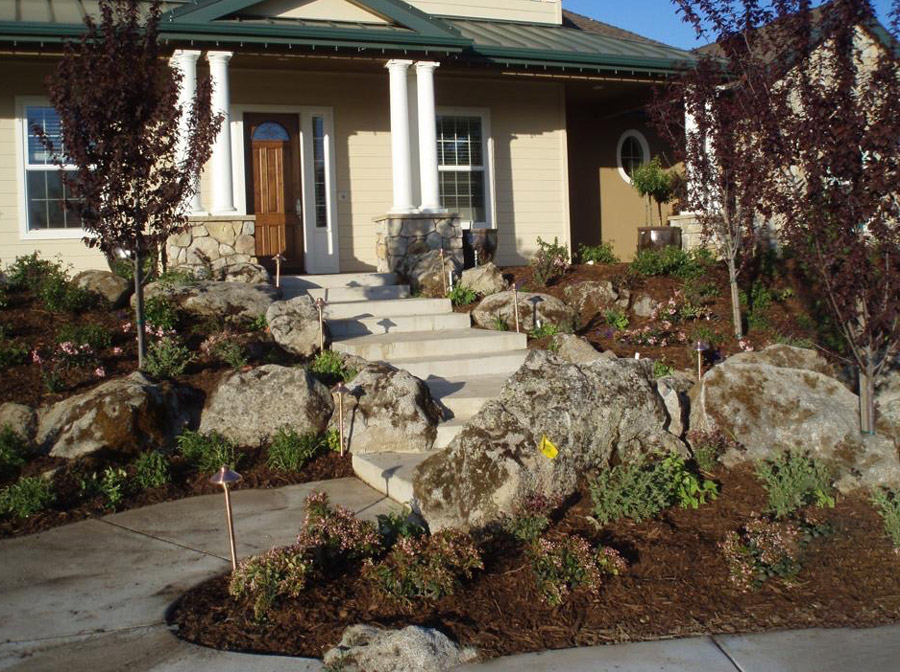 stone boulders front entry way landscape